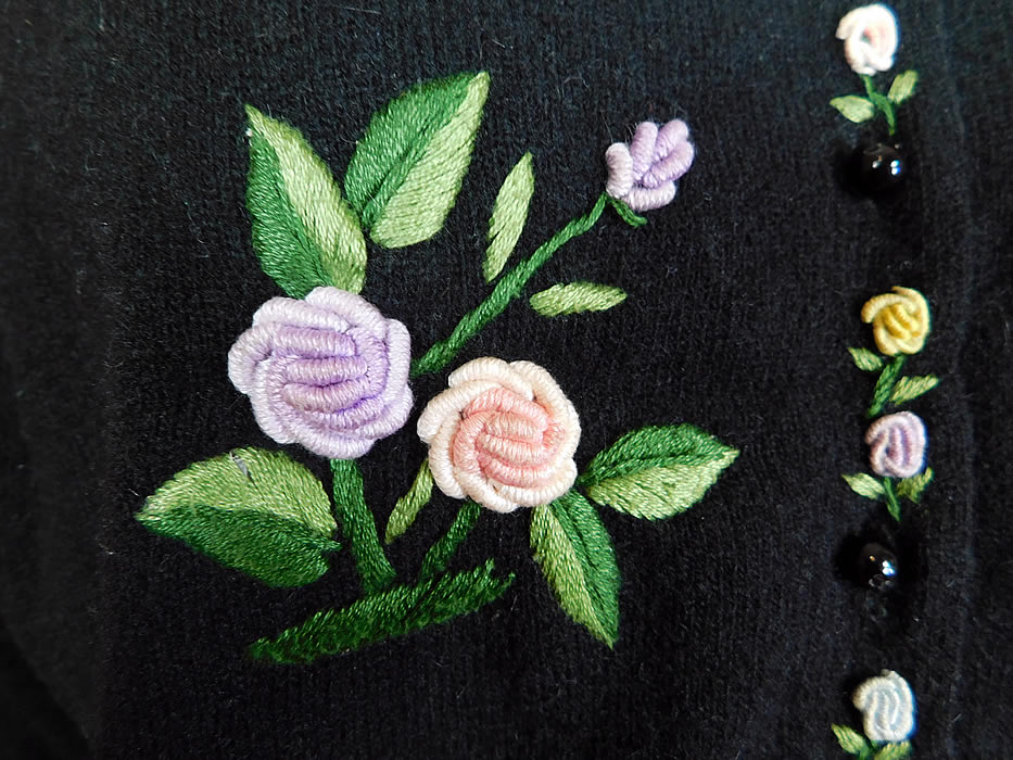 Vintage Hong Kong Black Lambswool Angora Rabbit Rosette Embroidered Sweater
.It is made of a black lambswool, angora rabbit hair knit fabric with pastel raised French knot twisted woven wheel stitch hand embroidery work rosette flowers and padded satin stitch embroidered green ombre leaves.