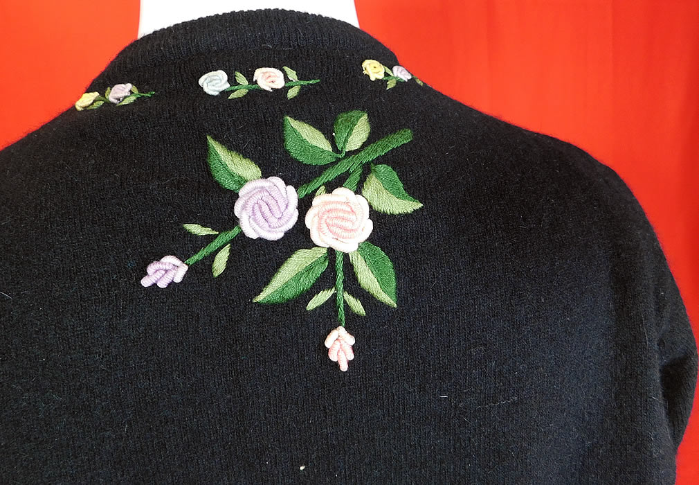 Vintage Hong Kong Black Lambswool Angora Rabbit Rosette Embroidered Sweater
The sweater measures 22 inches long, with a 42 inch bust, 34 inch waist, 16 inch back and 22 inch long sleeves.