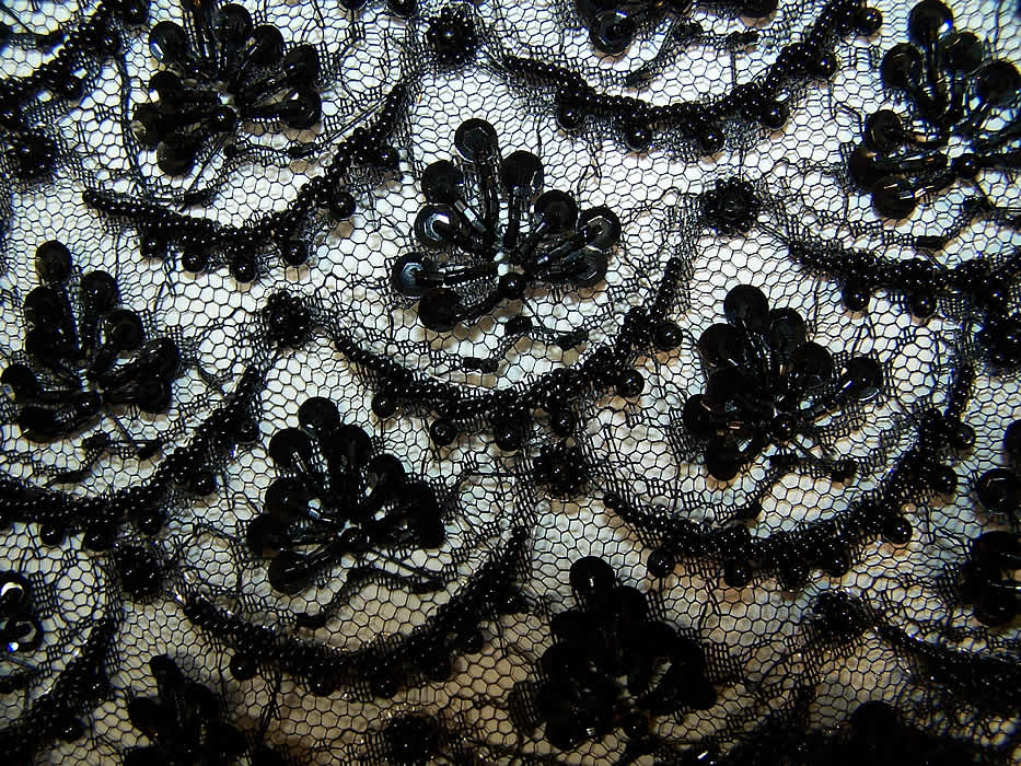 up close The floral lace wedding dress has a beautiful black beaded