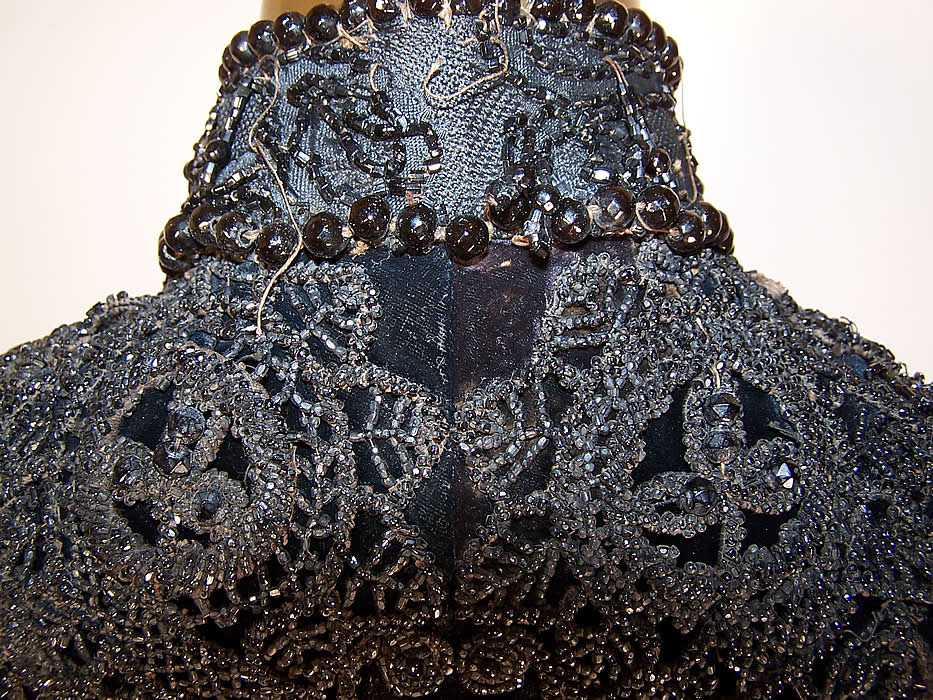 Victorian Black Velvet Jet Beaded Applique Fringe Mourning Mantle Cape Cloak close up with some missing, loose beads and tassels 
