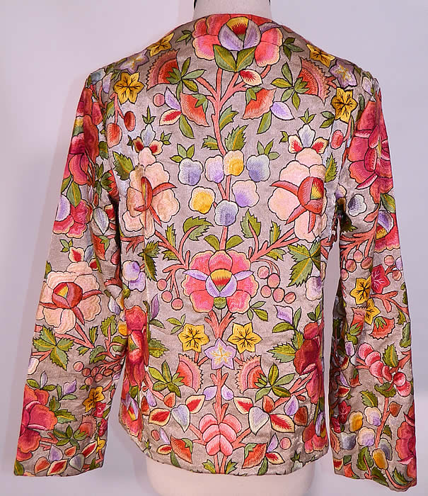 Vintage Silver Metallic Lamé Silk Embroidered Floral Leaf Coat Jacket. The coat measures 22 1/2 inches long, with a 36 inch waist, 36 inch bust, 13 inch back and 23 inch long sleeves. It is in excellent condition. This is truly an exceptional piece of wearable textile art! 