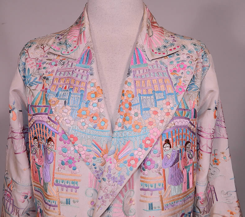 Vintage Chinese Figural Pastel Silk Embroidered Piano Shawl Long Coat Jacket. This exquisitely embroidered quality made jacket has a long loose fitting boxy style, with long full sleeves, an embroidered wide lapel collar, silk button front closures and is fully lined in silk inside. It was created from an antique 1920s finely embroidered Canton Chinese piano shawl fabric.