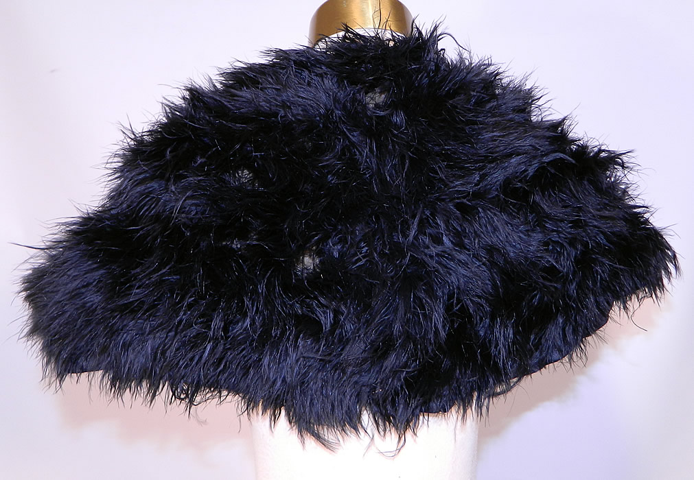 Edwardian Black Ostrich Feather Collar Cloak Cape Stole Shawl Silk Rope Ties. It is in good condition, with only some slight molting of feathers and the bottom silk lining is frayed in areas. This is a wonderful piece of feather wearable art! 