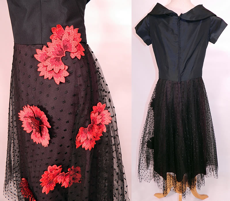 Vintage Ernest Newman Black Taffeta Polka Dot Net Red Flower Applique Cocktail Dress. This cocktail party dress has a form fitting sheath style, with a folded off the shoulder collar, wide plunging V front neckline, short cap sleeves, mid length pencil skirt and back zipper closure.