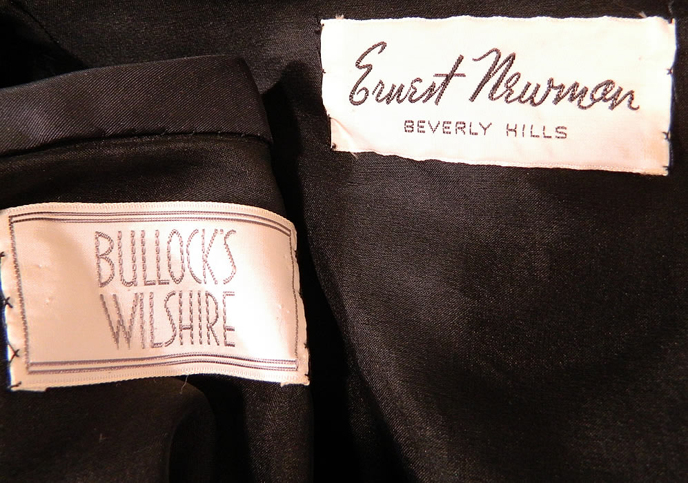 Vintage Ernest Newman Black Taffeta Polka Dot Net Red Flower Applique Cocktail Dress. There is a "Ernest Newman Beverly Hills" designer and "Bullock's Wilshire" department store labels sewn inside. The dress measures 41 inches long, with 34 inch hips, a 24 inch waist and 34 inch bust. It is in good condition. This is truly a wonderful piece of wearable designer art.
