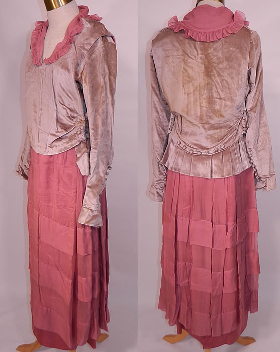 Vintage Pink Silk Gray Velvet Button Trim Late Teens 1915 WWI Era Tea Dress. This delightful tea dress has a loose fitting layered style, with an attached velvet blouse top, pink silk ruffle collar, long sleeves with velvet button trim cuffs, belted back with a pleated back skirt drape, a pink silk pleated layered long tea length skirt, with many snap, hook closures and is fully lined.