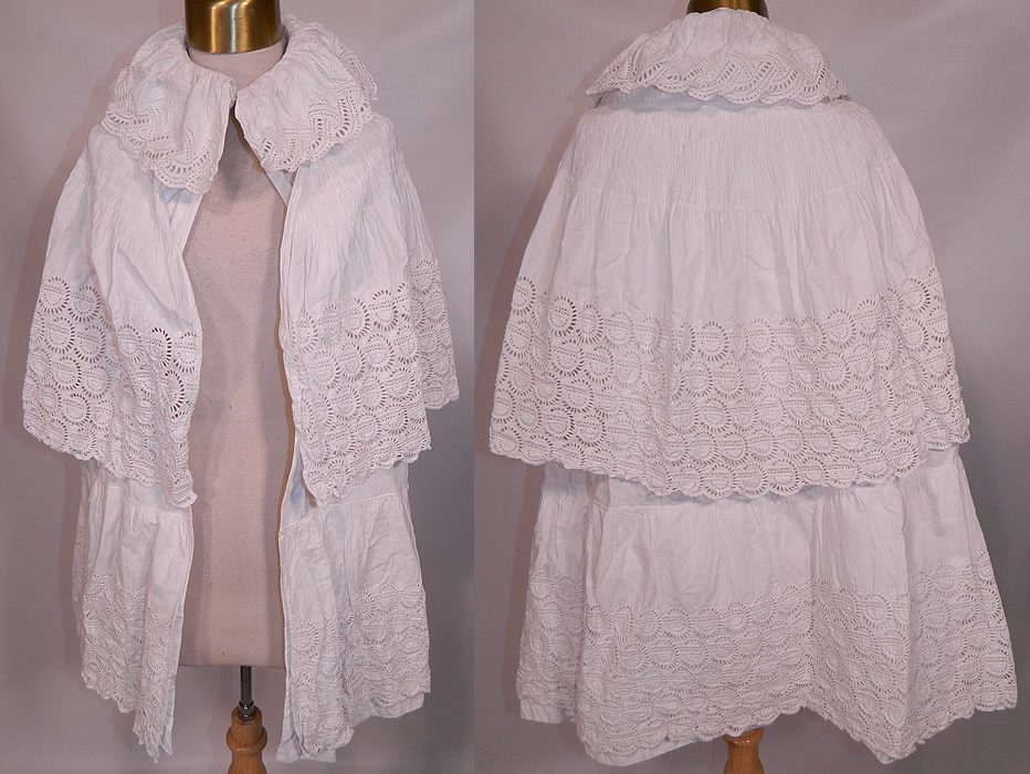 Victorian Broderie Anglaise Eyelet Embroidered Whitework Cotton Pique Cloak Cape. This antique Victorian era broderie anglaise eyelet embroidered whitework cotton pique cloak cape dates from the 1890s.