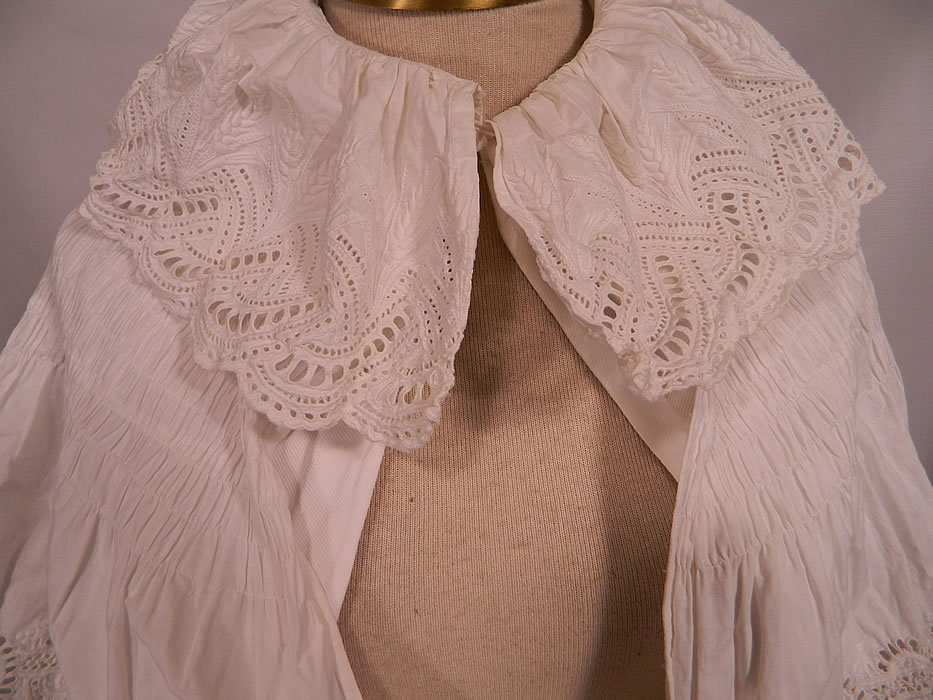 Victorian Broderie Anglaise Eyelet Embroidered Whitework Cotton Pique Cloak Cape. It is made of a white cotton, pique fabric with broderie anglaise embroidery eyelet cutwork lace whitework needlework.