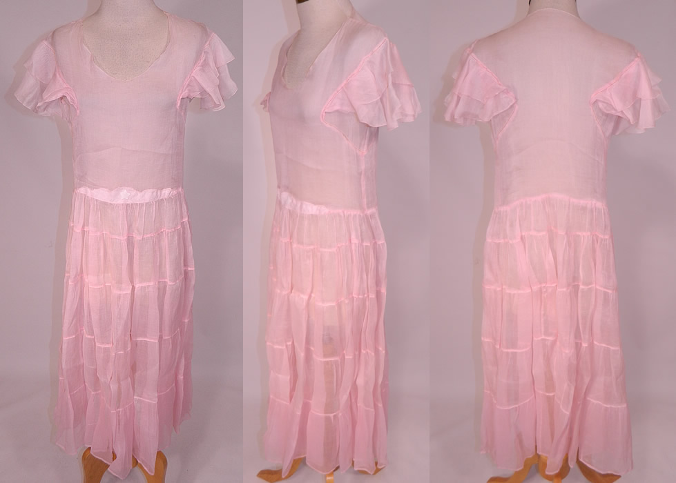 Vintage Pink Pastel Pink Organdy White Embroidered Star Applique Party Dress
This vintage pink pastel organdy white embroidered star appliqué party dress dates from the 1930s. The dress measures 45 inches long, with 42 inch hips, a 30 inch waist and 34 inch bust. 