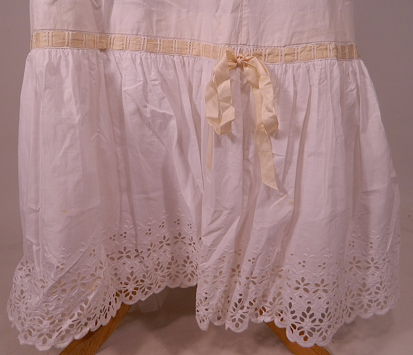 Victorian White Cotton Broderie Anglaise Eyelet Embroidery Cutwork Lace Petticoat Skirt
This pretty petticoat skirt has a flared full style, with fitted waistband, mother of pearl button closure on the back and layered bottom ruffle. The petticoat measures 40 inches long, with a 25 inch waist and is 150 inches in circumference at the bottom. 