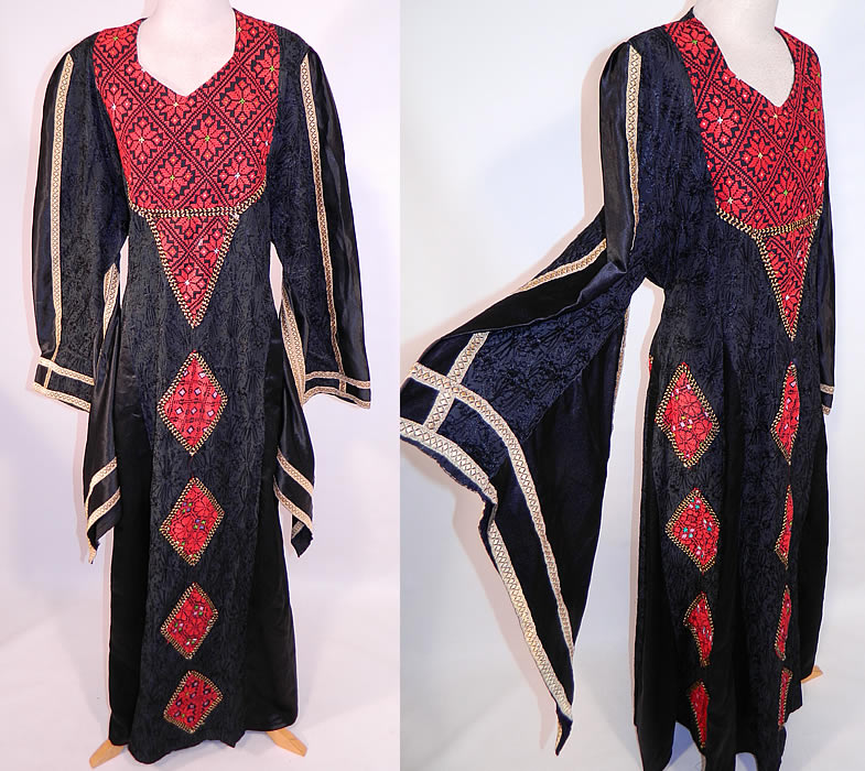 Vintage Al-Karnak Jordan Bedouin Kaftan Jalabiya Thobe Embroidered Maxi Dress
This vintage Al-Karnak Jordan bedouin kaftan jalabiya thobe embroidered maxi dress dates from the 1970s. It is made of a black silky polyester fabric with black chain stitching embroidery work done in a floral pattern and red cross stitch embroidery work done in a geometric floral design on the bib top and diamond shapes appliquéd down the front skirt.