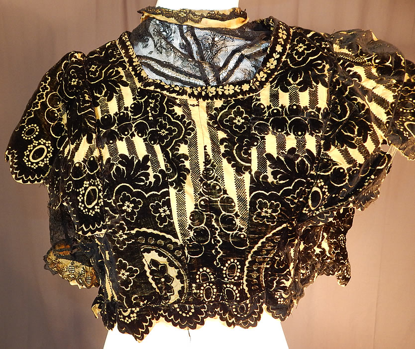 Victorian Yellow Silk Black Burnout Voided Velvet Devore Chantilly Lace Bodice
It is made of a luxurious yellow silk and black voided cut velvet burnout devore fabric, with a fancy baroque floral design and a black Chantilly lace undershirt.