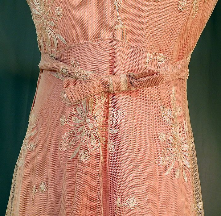 Vintage Cream Tambour Embroidery Net Lace Pink Nylon Slip Dress Bias Cut Gown
The dress measures 58 inches long, with 42 inch hips, a 28 inch waist and 36 inch bust. It is in good condition, with only a few tiny frayed pulls in the net fabric top. This is truly a wonderful piece of wearable lace art!