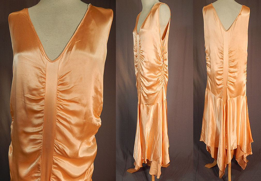 Vintage Peach Silk Satin Charmeuse Handkerchief Hem Skirt Drop Waist Flapper Dress
The dress measures 52 long with varying lengths, a 32 inch waist, 38 inch bust and 38 inch hips. It is in excellent condition. This is truly a wonderful piece of Art Deco wearable textile art! 