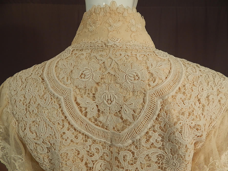 Vintage Antique Patchwork Cream Lace Floral Beaded Applique Trim Suit Jacket
There is a size 10 tag sewn inside. The jacket measures 22 inches long, with a 38 inch bust, 32 inch waist and 22 inch long sleeves. It is in excellent condition. This is truly an exquisite piece of patchwork lace wearable art!