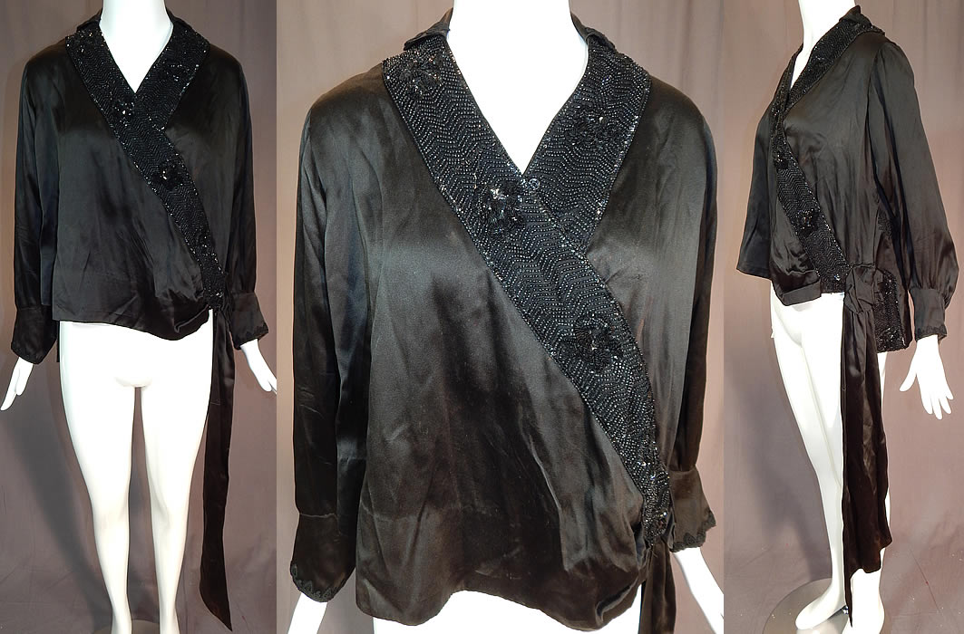 Vintage Art Deco Black Silk Sequin Beaded Flapper Blouse Dress Shirt
This vintage Art Deco black silk sequin beaded flapper blouse dress shirt dates from the 1920s. It is made of a black silk fabric, with sequins, jet beading and black floral lace appliqué trim on the bottom back top, collar and cuffs. 