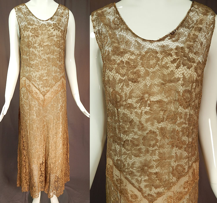 Vintage Gold Metallic Lamé Lame Lace Drop Waist Flapper Dress & Gray Silk Slip
This exquisite vintage gold metallic lamé lace drop waist flapper dress and gray silk slip dates from the 1920s. It is made of a sheer fine gold metallic thread lamé lace net fabric woven into a floral rose leaf pattern.