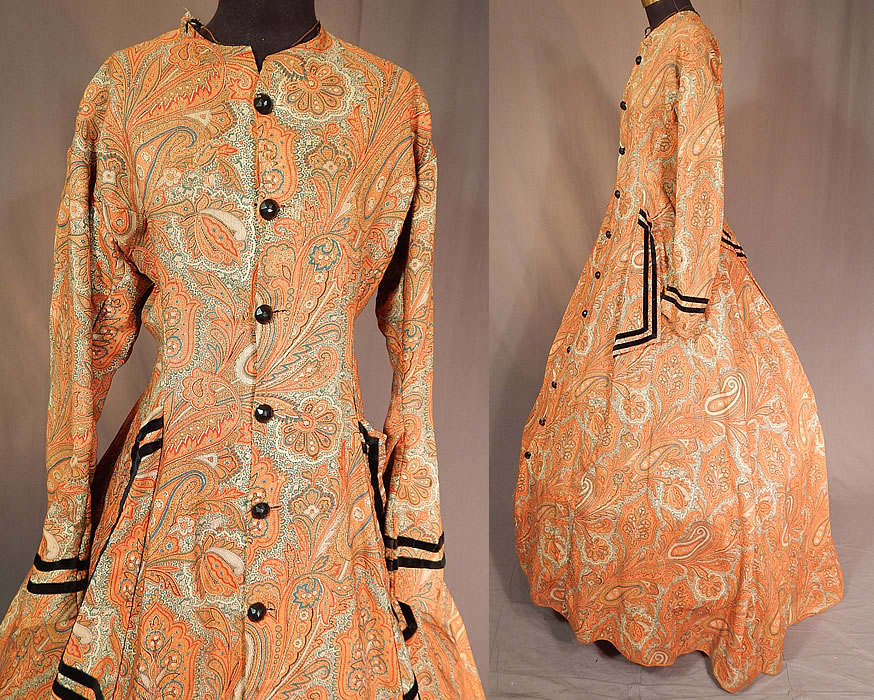 Victorian Civil War Era Paisley Wool Hoop Skirt Morning Wrapper Gown Dress
This wonderful wrapper morning gown dress has a long floor length full hoop skirt (hoop not included underneath), with black velvet piping trim accents on the sleeve cuffs, front faux pocket sides, back skirt drape, with newly replaced faceted plastic black button closures all the way down the front and is lined in a brown cotton fabric inside the top, skirt hemline. 
