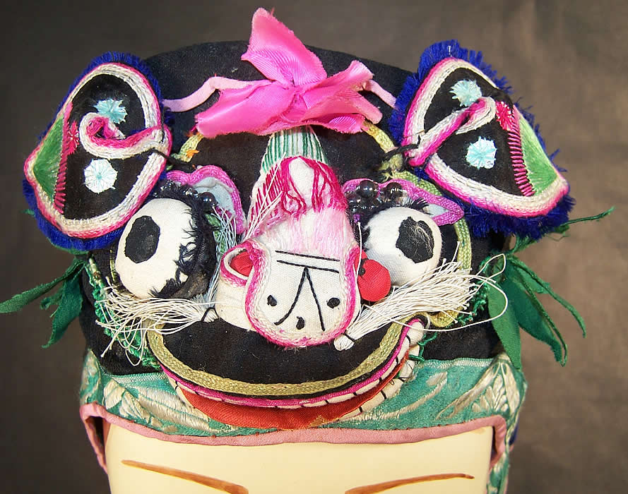 Chinese Child Infant Silk Applique Tiger Wind Hat close-up view.