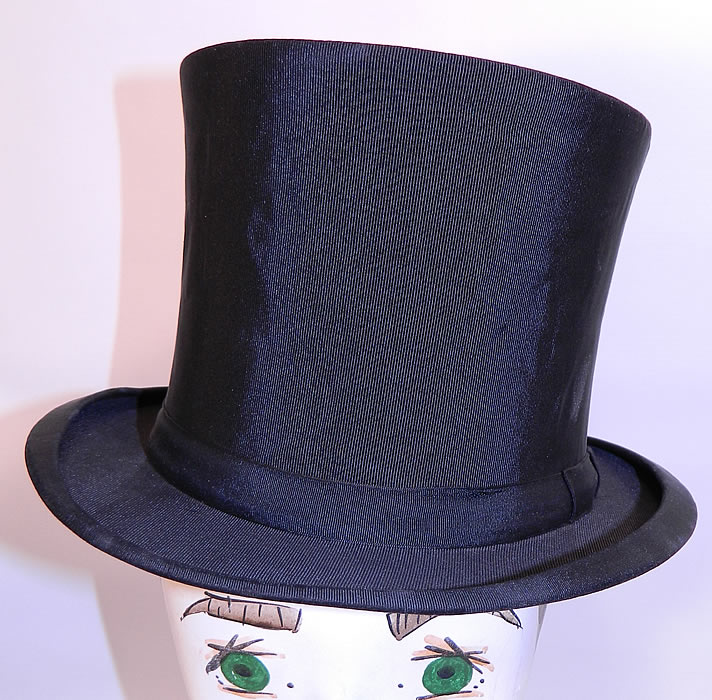 Vintage Kennedys Victorian Gentlemen Black Silk Collapsible Opera Top Hat. This vintage Victorian era Kennedy's gentlemen's black silk collapsible opera top hat dates from 1900.
