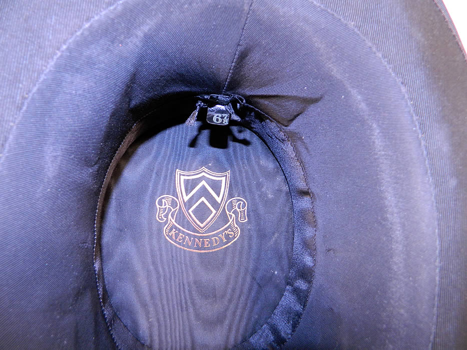 Vintage Kennedys Victorian Gentlemen Black Silk Collapsible Opera Top Hat Close up. It is fully lined in black silk and has a "Kennedy's" gold embossed label inside and size 6 7/8 tag.