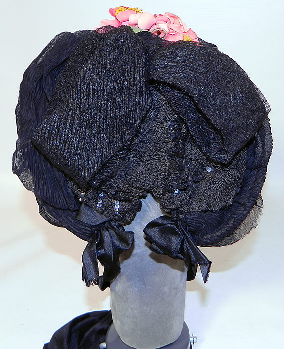 Victorian Black Silk Crepe Pink Flower Trim Mourning Bonnet Hat. There is a black lace net sequin beaded trim on back and pink silk flower trim on top, which were probably added later after the mourning period was over.