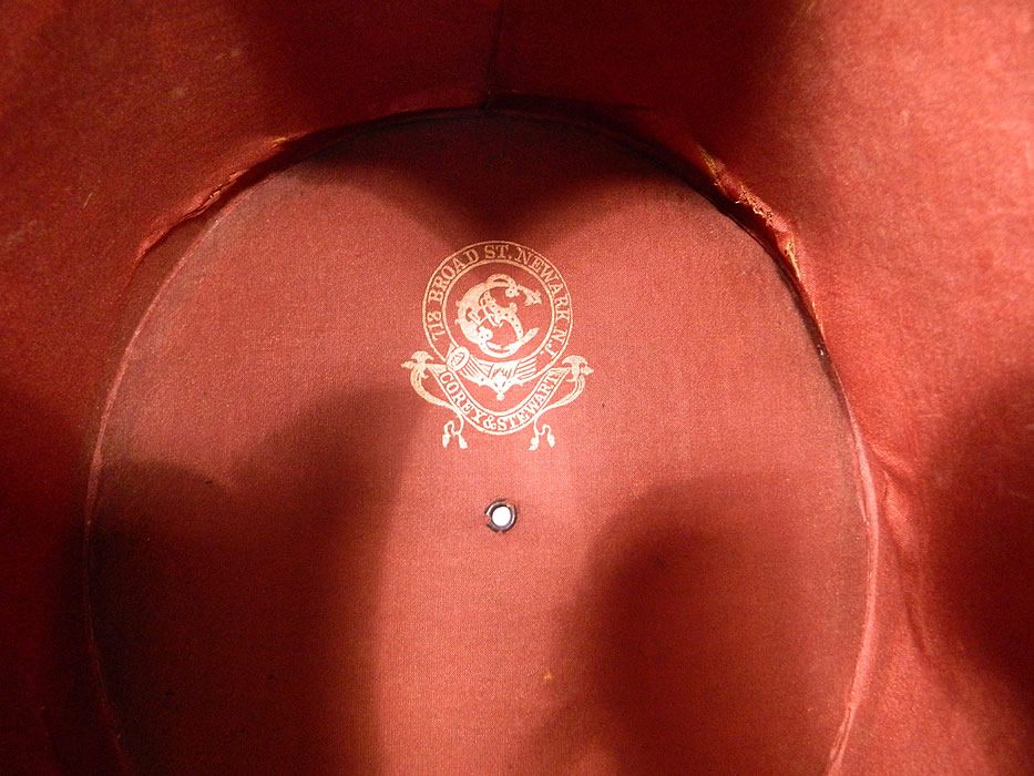 Victorian Corey & Stewart NJ Civil War Tall Lincoln Black Beaver Stovepipe Top Hat . It is  lined inside with a red silk fabric and gold embossed lettering from "718 Broad St. Newark, N.J. Corey & Stewart" label.