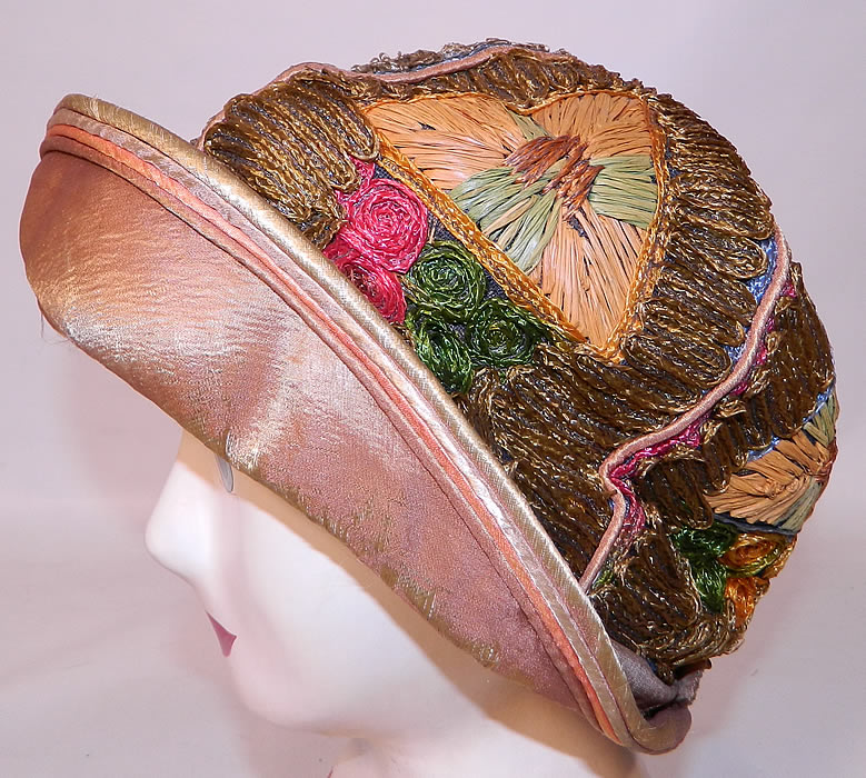 Vintage Colorful Straw Raffia Ribbon Work Embroidered Flapper Cloche Hat. This fabulous flapper cloche style  hat has a small iridescent peach color silk rolled upturned brim. 
