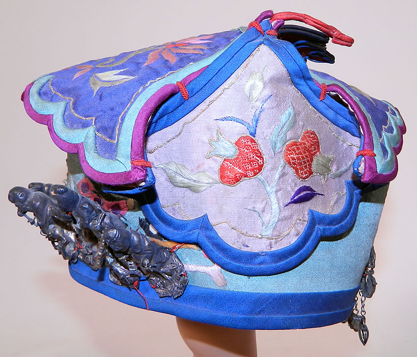 Antique Chinese Child Infant Silk Embroidered Silver Immortals Charm Wind Hat. 
It is hand stitched, made of a blue silk fabric, with colorful silk raised padded satin stitch hand embroidered lotus flowers and pomegranates. 