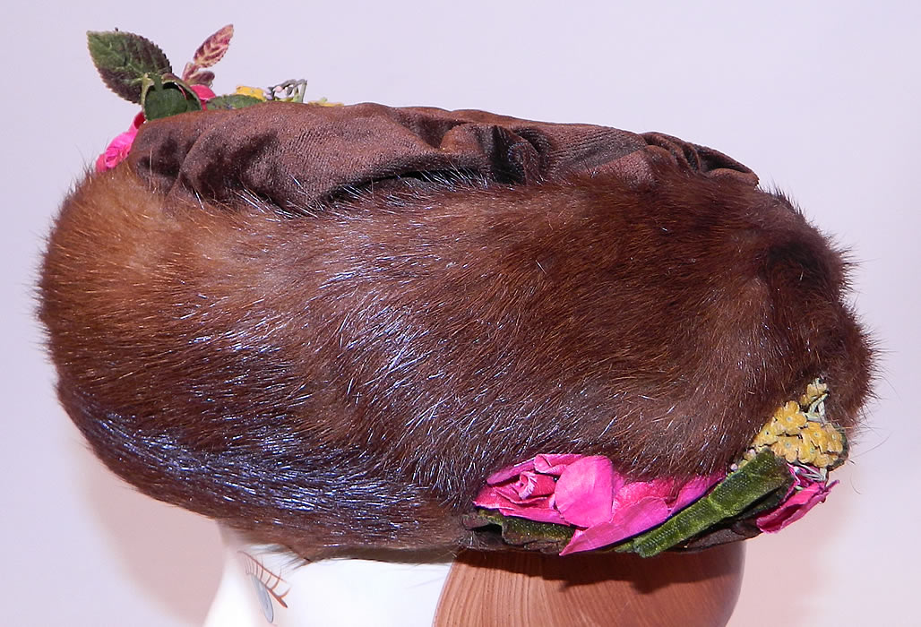Titanic Edwardian Brown Velvet Mink Fur Floral Trim Toque Traveling Winter Hat
This wonderful winter brimless toque travel hat has a large rotund circular style and would have sat perched atop a Gibson Girl style up do hairdo secured with hat pins. 