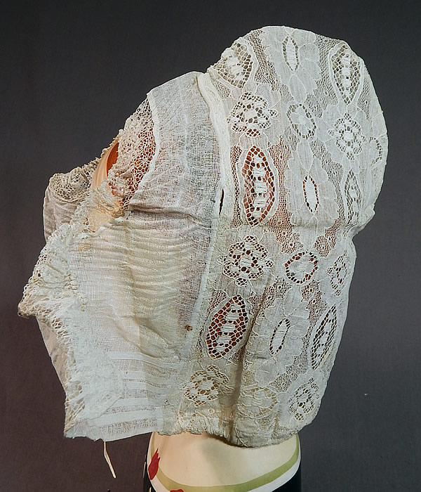 Vintage Antique Womens White Lace Dutch Folk Costume Bonnet Cap Hat
The beautiful bonnet measures 11 inches tall, 12 inches in circumference around the bottom with an additional 6 inch tie strap on each side and is 6 inches wide deep, 12 inches wide from the front flaps to the back. 