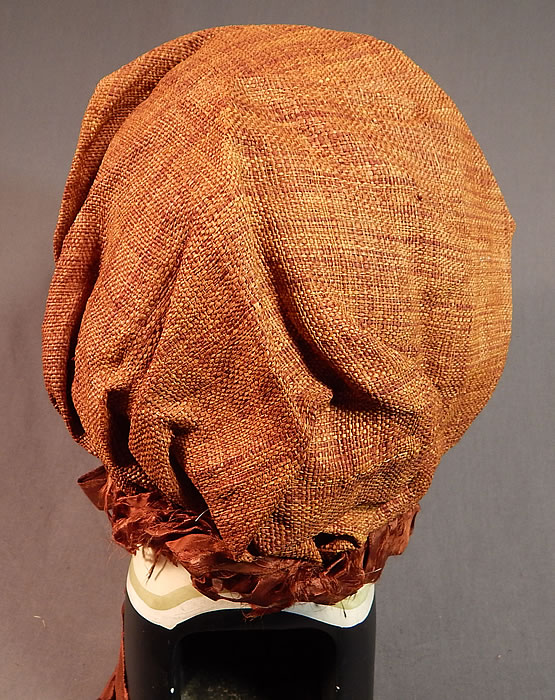 Victorian Woven Brown Straw Chintz Fabric Trim Calash Sun Bonnet Hood Hat
The bonnet measures 26 inches around the front opening, is 11 inches wide along the front and is 11 inches high.