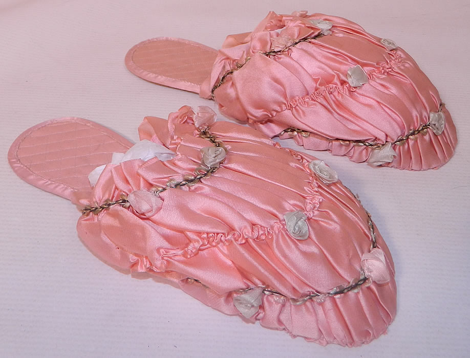 Vintage Prisma Pink Silk Rosette Ribbon Work Boudoir Mules Slipper Shoes. They are made of a pink pastel silk fabric, with ruched gathering and tiny floral pastel silk rosette ribbon work trim.