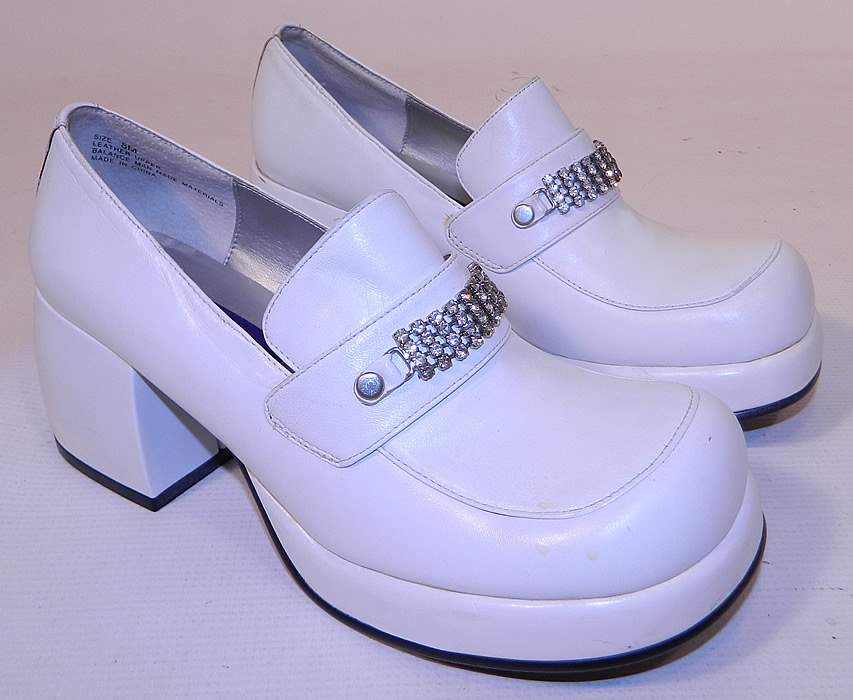 Unworn Vintage Baci Rhinestone Trim White Leather Loafers Disco Platform Shoes. This pair of unworn vintage Baci rhinestone trim white leather loafers disco platform shoes date from the 1990s. 