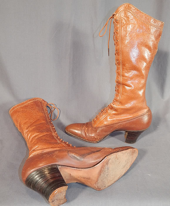 Victorian Vintage I. Miller NY Brown Leather High Top Lace-up Hiking Boots Shoes
These beautiful brown boots are very tall, perhaps using for hiking or riding, with pointed toes, the original brown shoe string laces and stacked wooden cube heels. 