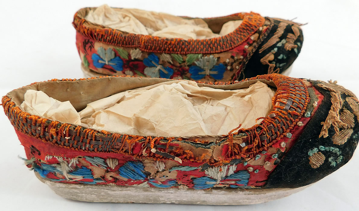 Antique 19th Century Chinese Silk Embroidered Childs Wedge Pedestal Boat Shape Shoes
These are truly a rare and wonderful piece of antique Chinese shoe art! 