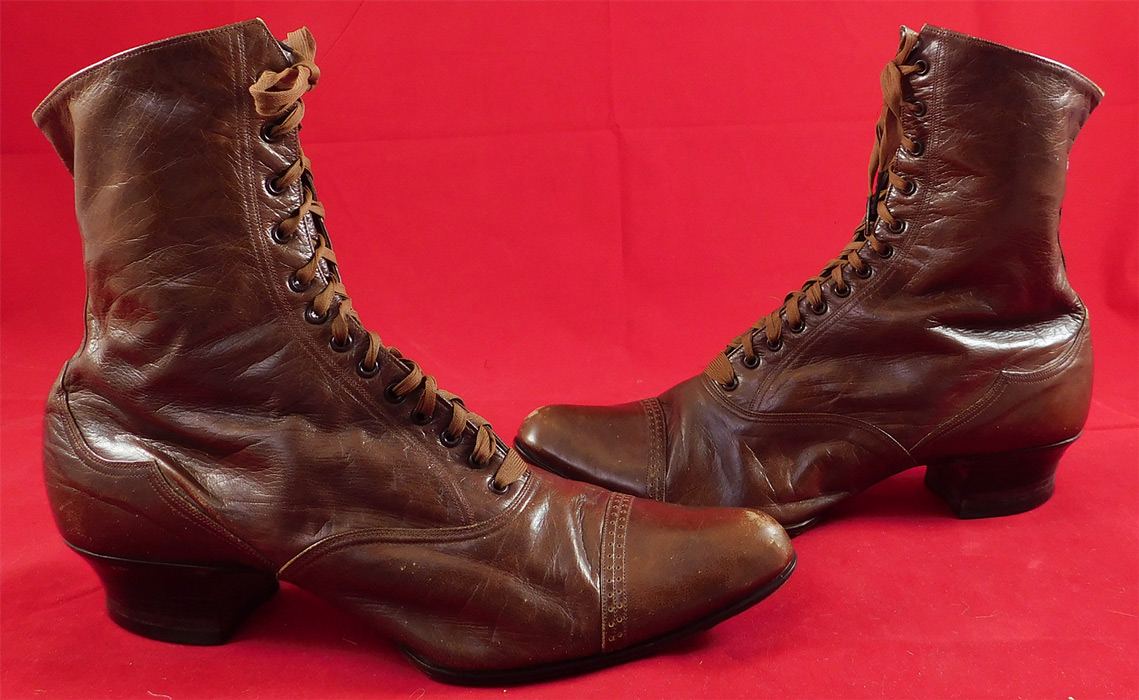 Victorian Antique Womens Brown Leather Laceup Boots Pointed Toe Shoes
The boots measure 7 inches tall, 10 inches long, 2 3/4 inches wide, with a 1 inch high heel. These antique boots are difficult to size for today's foot, but my guess would be approximately a US size 6 or 7 narrow width.