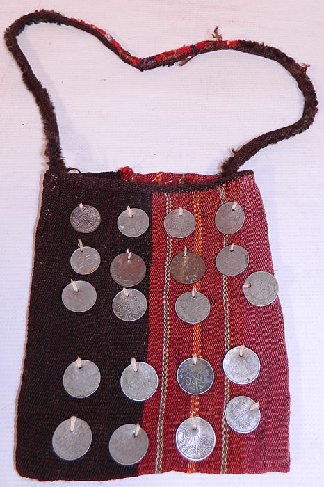 Antique Bolivia Silver Coin Chuspa Coca Woven Weave Bag
This vintage antique Bolivia silver coin chuspa coca woven weave boho bag dates from the 1970s. It is made of a colorful natural dye wool weave fabric with a woven striped pattern design done on both sides.