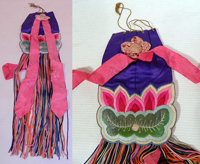 Antique Chinese Colorful Silk Embroidered Lotus Flower Fringed Pouch Purse Bag
This antique Chinese colorful silk embroidered lotus flower fringed pouch purse bag dates from the 1920s. It is made of a purple silk fabric, with a raised padded satin stitch hand embroidered pink lotus flower and green leaf pad.