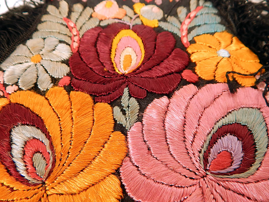 Vintage Matyo Hungarian Folk Embroidery Colorful Floral Fringe Boho Purse
There is a floral pattern design densely embroidered onto the fabric. This beautiful boho bag purse has a round pouch style, with black silk fringe trim edging, black rope carrying strap, is fully lined in linen and has an open top with no closure. 