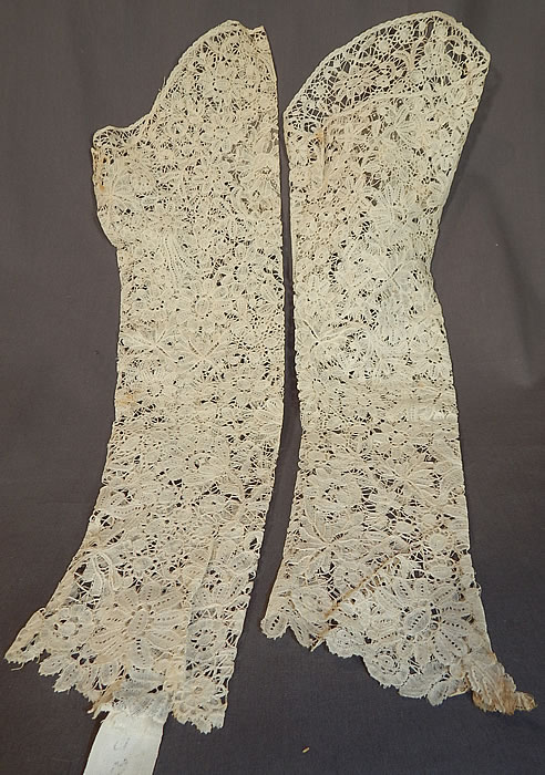 Antique Hand Made Brussels Point de Gaze Duchesse Bobbin Lace Dress Sleeves
This lovely lace pair of bridal wedding gown dress sleeves are a long arm length with a wide scalloped finished edge opening at the top, fitted lace scalloped edge cuffs and is sheer, unlined. 