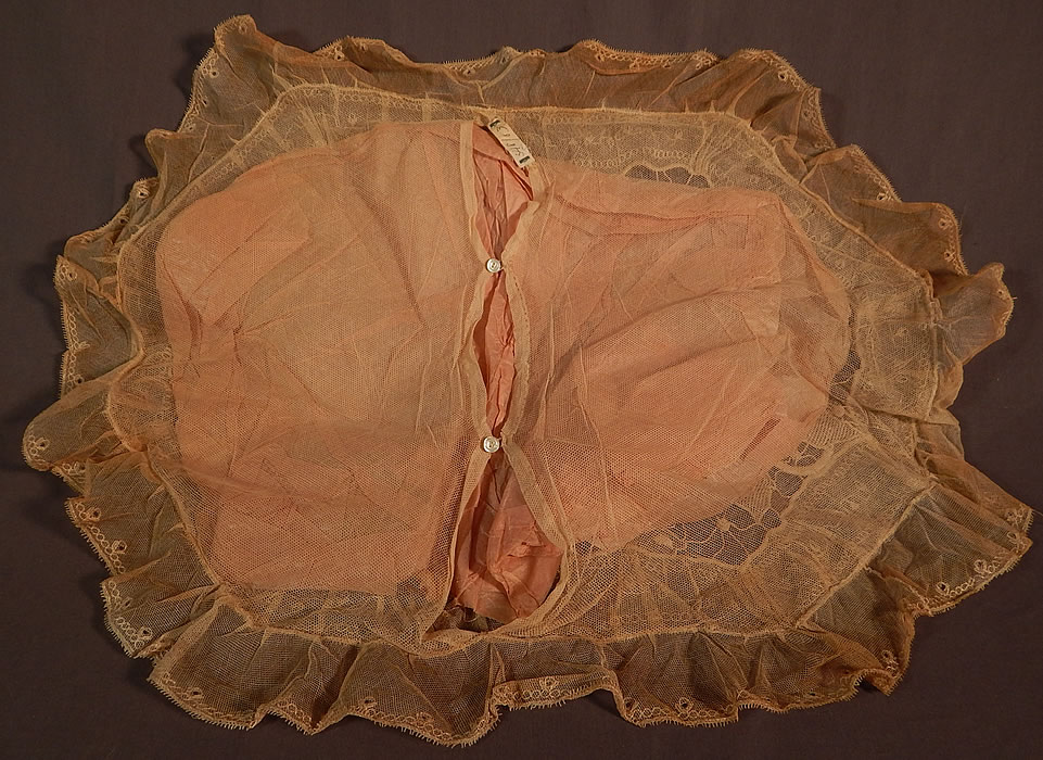 Vintage Embroidered Tulle Net Drawn Cutwork Grape Leaf Lace Boudoir Bed Pillow
This beautiful boudoir bed pillow sham case cover has an oval shape, with ruffle trim edging and an opening on back for inserting a pillow with tiny mother of pearl button closures. 