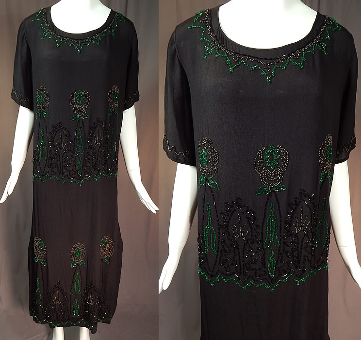 Vintage Art Deco Black Silk Crepe Emerald Green Beaded Floral Flapper Dress
This amazing Art Deco vintage black silk crepe emerald green beaded floral flapper dress dates from the 1920s. It is made of a black silk crepe de chine fabric, with emerald green, black and charcoal steel colored beading done in Art Deco abstract and floral designs.