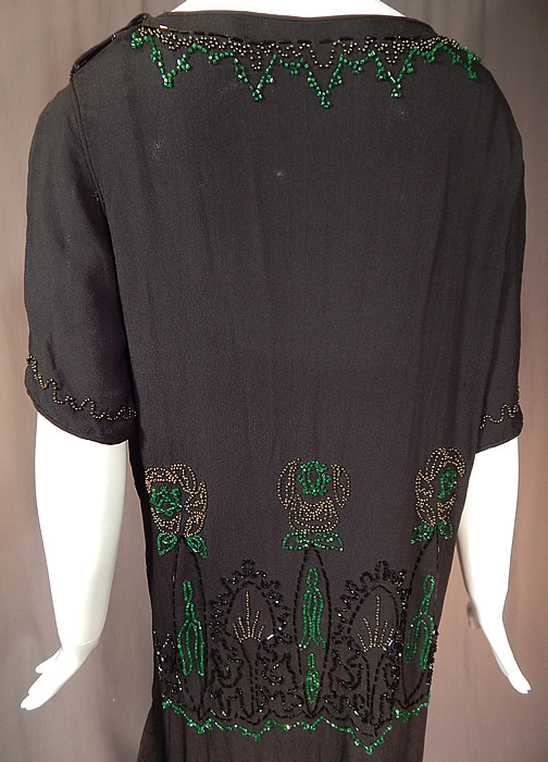Vintage Art Deco Black Silk Crepe Emerald Green Beaded Floral Flapper Dress
The dress measures 49 inches long, with a 42 inch bust, a 42 inch waist and 42 inch hips. It is in excellent condition. This is truly a wonderful piece of Art Deco wearable beaded textile art! 