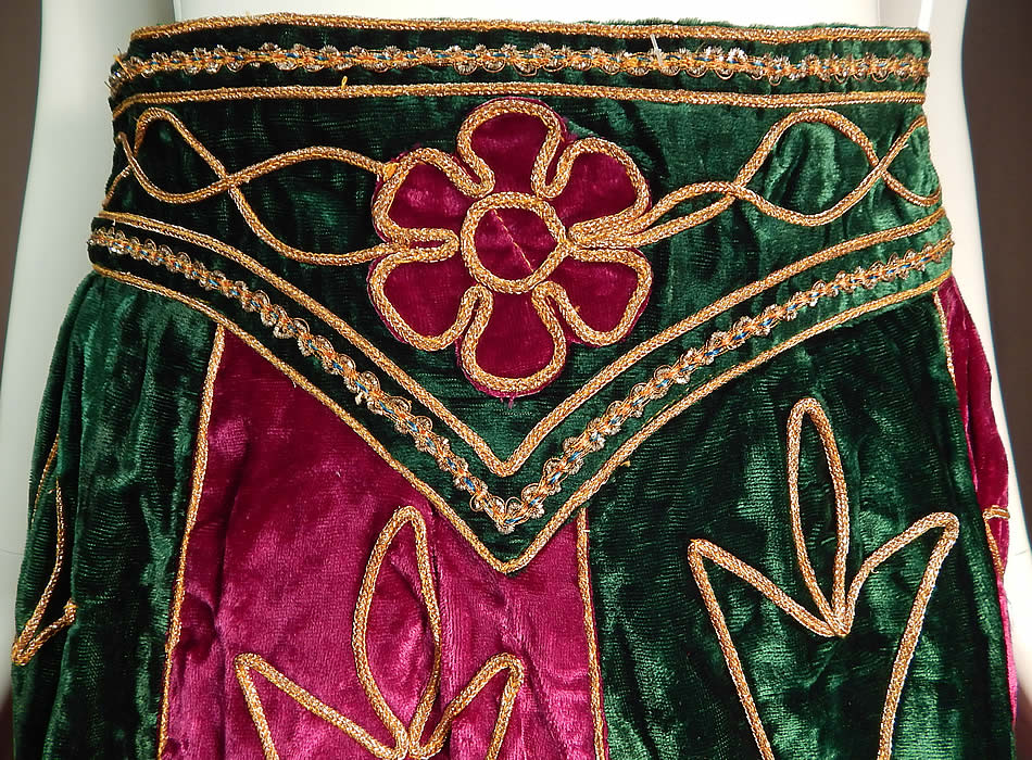 Vintage Indian Purple & Green Gold Embroidered Velvet Patchwork Maxi Skirt
This ethnic evening maxi skirt is a long floor length, with a wide belted style waistband coming to a point in the front, is fully lined and has no closure.
