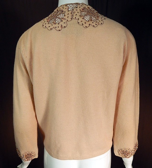 Vintage Vic & Vic Haute Couture Hong Kong Beaded Cutwork Cardigan Sweater
The sweater measures 20 inches long, with a 38 inch bust, 34 inch waist, 20 inch long sleeves and a 13 inch back. 