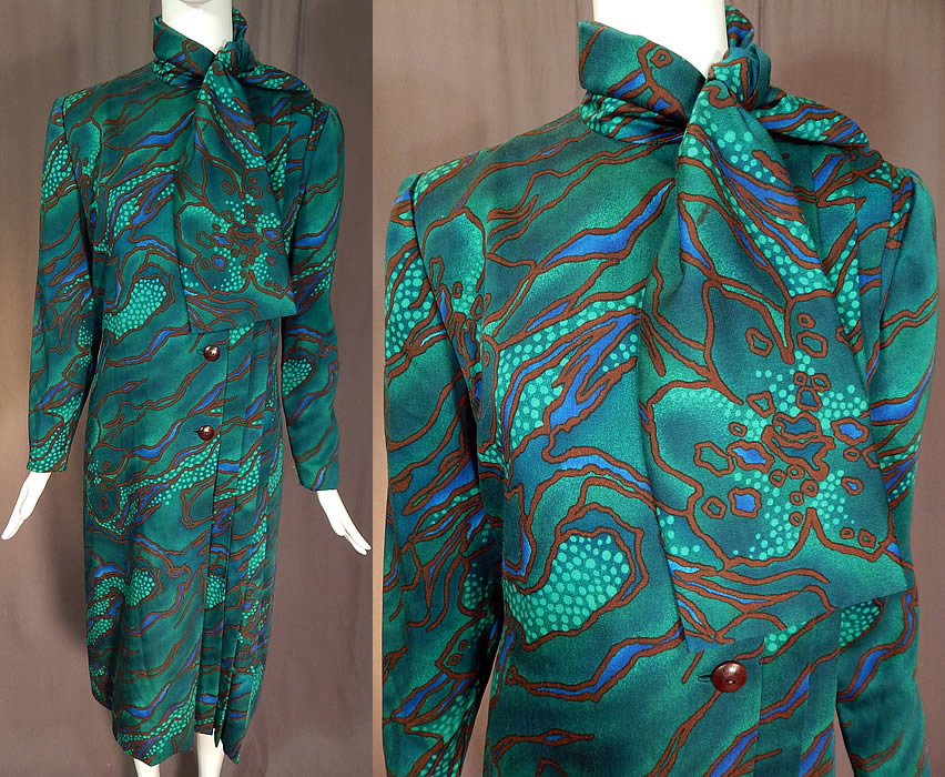 Vintage Pauline Trigere Green Abstract Stained Glass Floral Print Neck Scarf Dress
This vintage Pauline Trigere green abstract stained glass floral print neck scarf dress dates from the 1980s. It is made of a green wool cotton blend fabric, with a blue and brown abstract stained glass style floral print design. 
