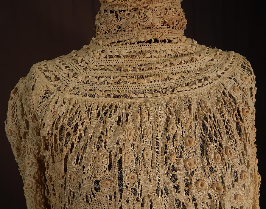 Edwardian Antique Cream Cluny Bobbin Lace Peplum Blouse Shirt Top
This beautiful blouse has a high neck lace collar, long full sleeves with tapered fitted cuffs, a linen fabric peplum skirted bottom hem, hook closures down the back and is fully lined in a sheer Swiss dot tulle net fabric inside. The top measures 17 inches long, 24 inches long with the additional skirted bottom, a 38 inch bust, 28 inch waist, 23 inch long sleeves, 14 inch back and 16 inch neck.