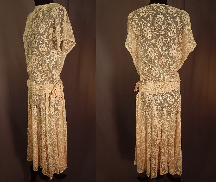 Vintage Cream Tulle Net Tambour Embroidery Floral Lace Belted Dress
This lovely lace dress has a fitted style, with belted side sash drape bow trim, short cap sleeves, a high neckline, shoulder, side snap closures and is sheer, unlined.