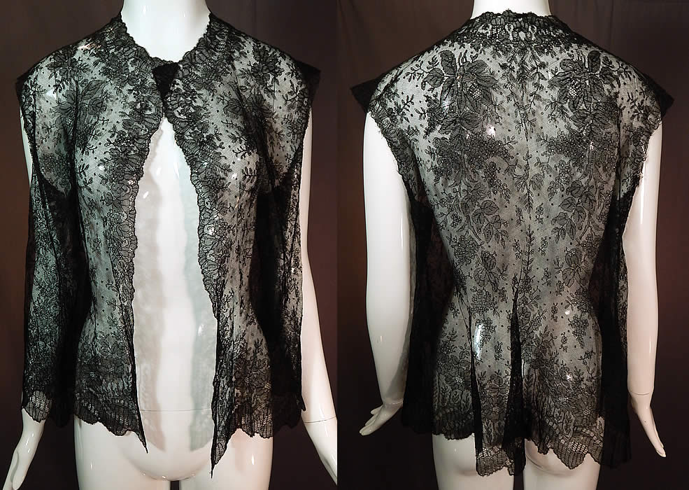 Victorian Antique Black Chantilly Lace Shawl Sleeveless Vest Jacket Top
This antique Victorian era black Chantilly lace shawl sleeveless vest jacket top dates from the 1860s. It is made of a sheer fine delicate black net French Chantilly lace, with a Swiss dot, floral foliage leaf pattern outlined in black threads with detailed shading effects and a decorative scalloped border edging. This lovely lace has a lush floral foliage design throughout.
